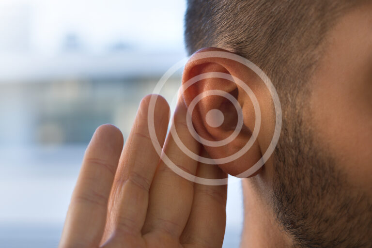 Tinnitus. Young Man With Hearing Problems Or Hearing Loss. Heari