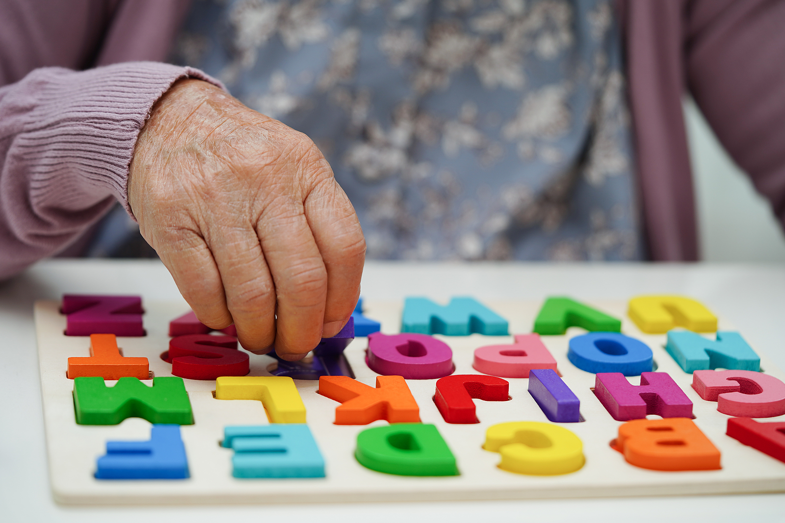 Asian Elderly Woman Playing Puzzles Game To Practice Brain Train