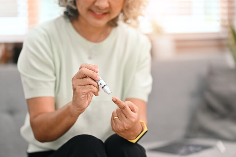 Cropped Shot Of Diabetic Mature Lady Taking Blood Sample With La