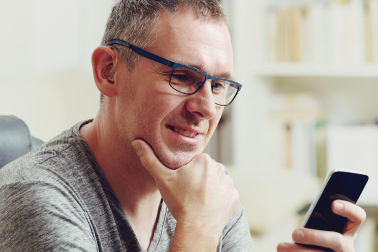 private hearing aids - man with hearing aid