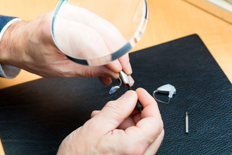private hearing aids - hearing aid acoustician at work