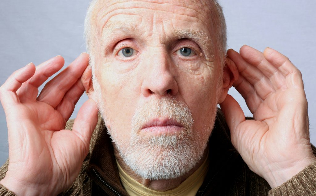 private hearing aids - old man hearing loss