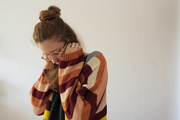 private hearing aids - depressed girl