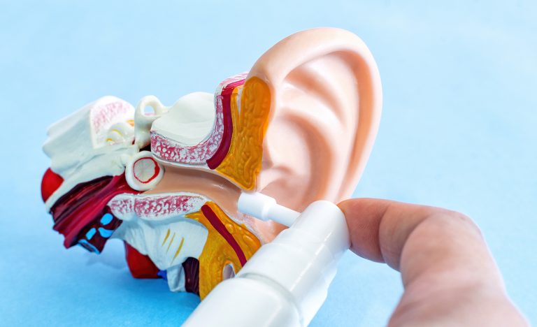 ear wax removal Lincoln - Using a spray to clean the ears