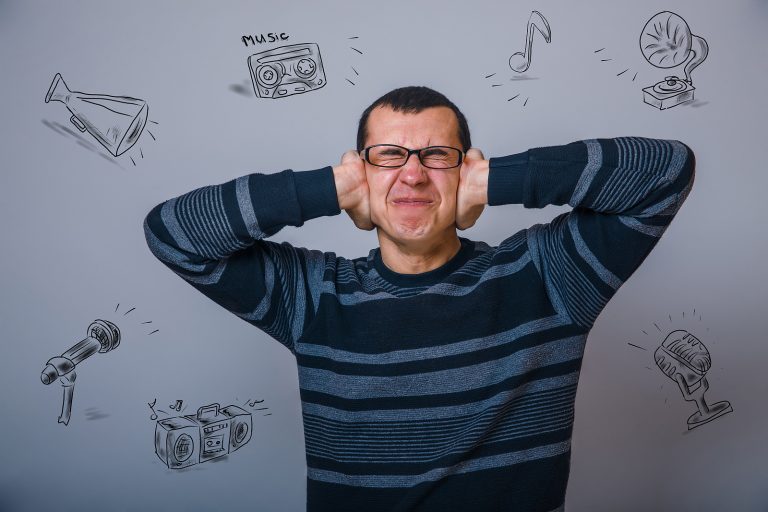 Private hearing aids - closes her ears loud music stress